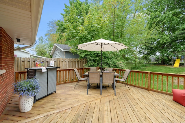 wooden deck featuring outdoor dining area