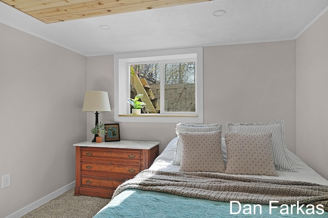 carpeted bedroom featuring baseboards and recessed lighting