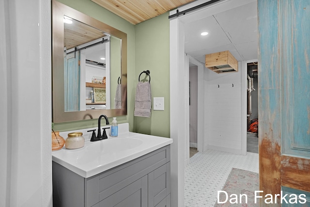 bathroom with tile patterned floors, vanity, and recessed lighting