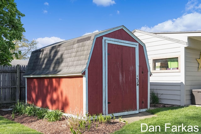 view of shed with fence