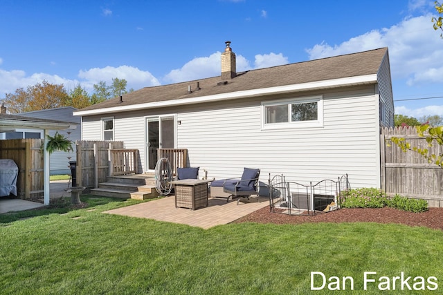 rear view of property with a chimney and a patio