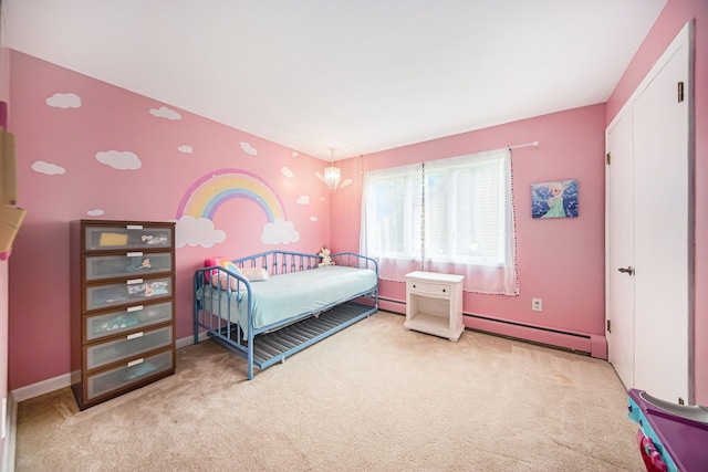 carpeted bedroom with a baseboard radiator and baseboards