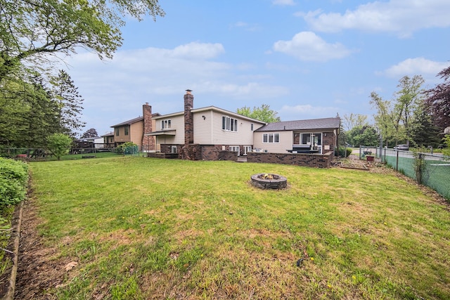 view of yard with an outdoor fire pit