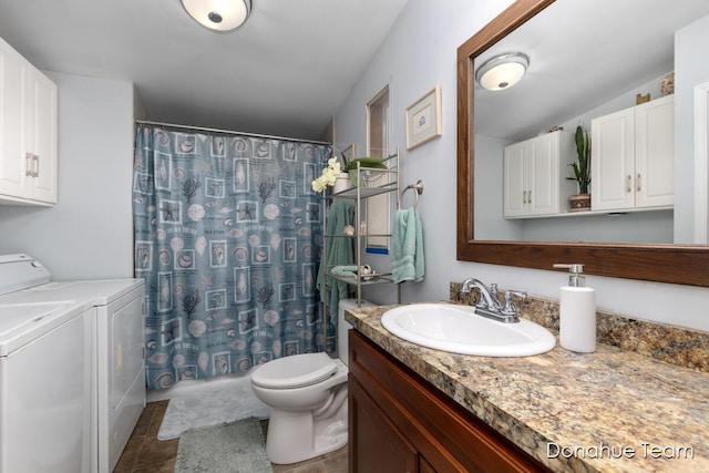 full bathroom with toilet, washing machine and dryer, vanity, and curtained shower