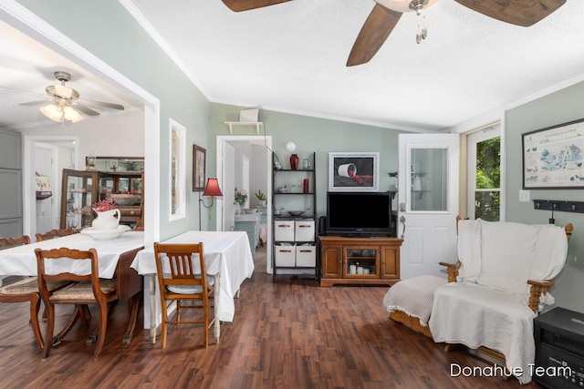 dining space featuring ceiling fan, crown molding, dark wood finished floors, and lofted ceiling