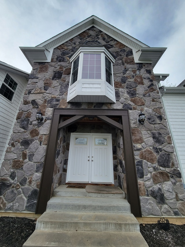 10726 Davisburg Rd, Davisburg, MI 48350 - view of exterior entry featuring stone siding