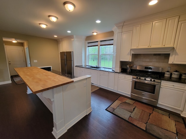 10726 Davisburg Rd, Davisburg, MI 48350 - kitchen with gas stove, freestanding refrigerator, a sink, dark wood-style floors, and wood counters