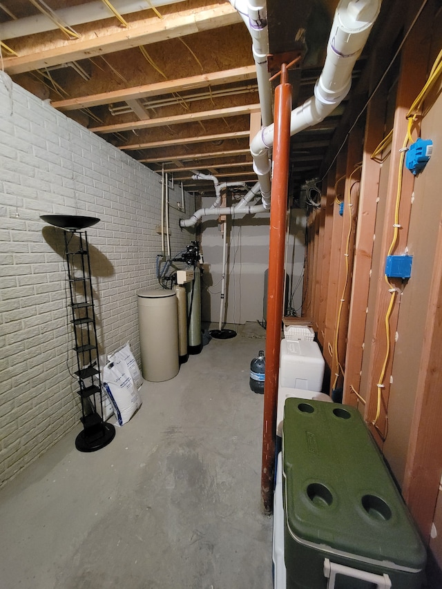 10726 Davisburg Rd, Davisburg, MI 48350 - unfinished basement featuring a water softener and brick wall