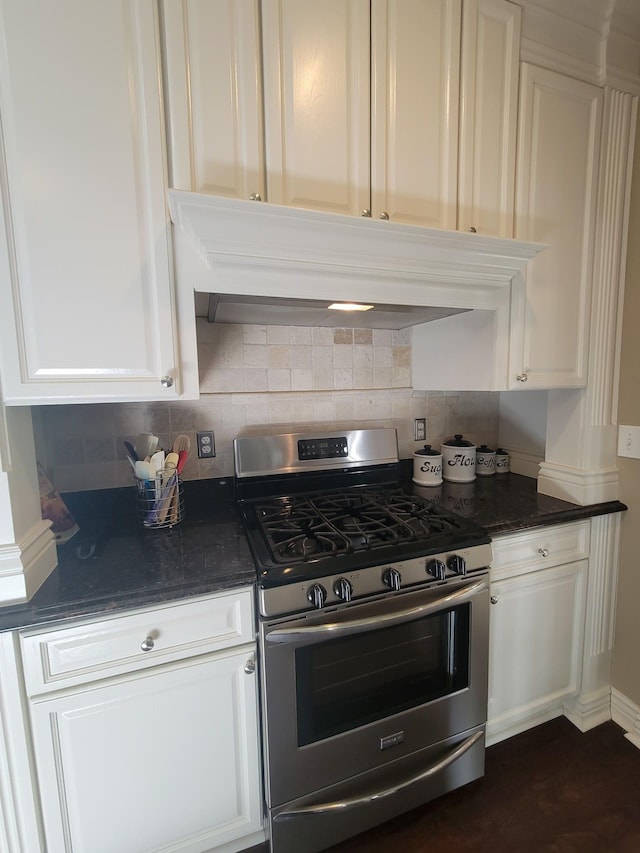 10726 Davisburg Rd, Davisburg, MI 48350 - kitchen with stainless steel gas range oven, tasteful backsplash, and white cabinetry