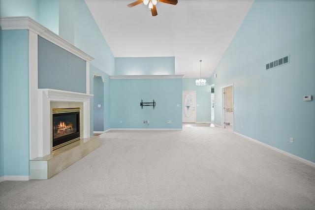 unfurnished living room featuring high vaulted ceiling, a ceiling fan, a premium fireplace, carpet flooring, and baseboards