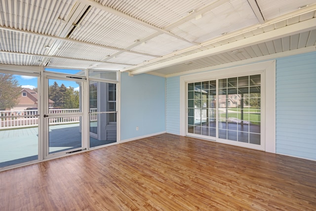 unfurnished sunroom with healthy amount of natural light