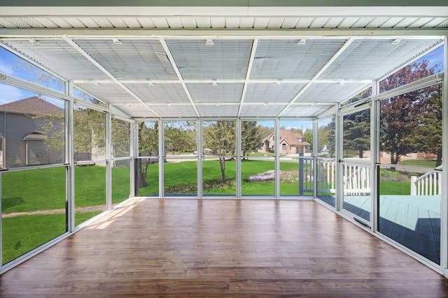 unfurnished sunroom with plenty of natural light