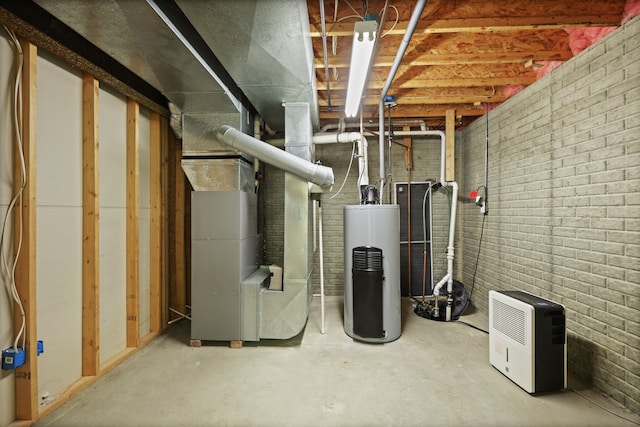 utility room featuring heating unit and gas water heater