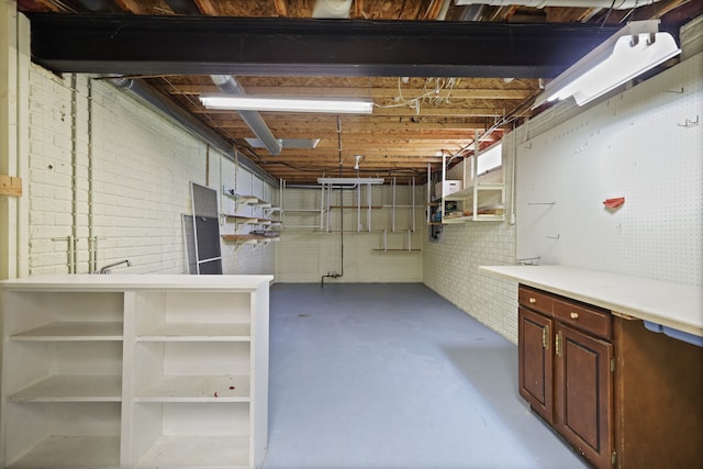 unfinished below grade area with brick wall