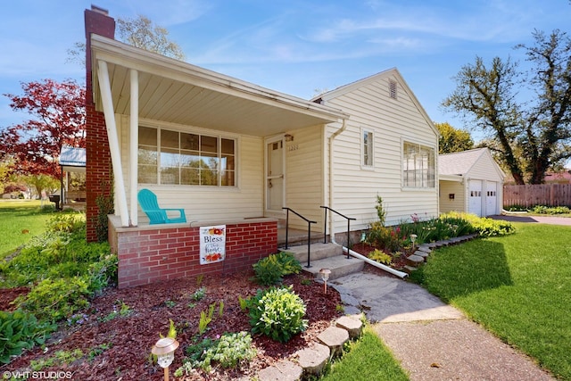 1200 Mohawk Ln, Saint Joseph, MI 49085 - view of front of home featuring a garage and a chimney