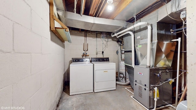 1200 Mohawk Ln, Saint Joseph, MI 49085 - washroom with washer and clothes dryer and concrete block wall