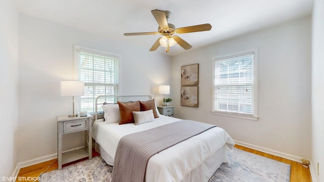 1200 Mohawk Ln, Saint Joseph, MI 49085 - bedroom with baseboards, light wood-style flooring, and a ceiling fan