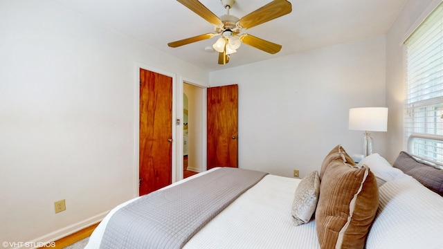 1200 Mohawk Ln, Saint Joseph, MI 49085 - bedroom with baseboards, wood finished floors, and a ceiling fan