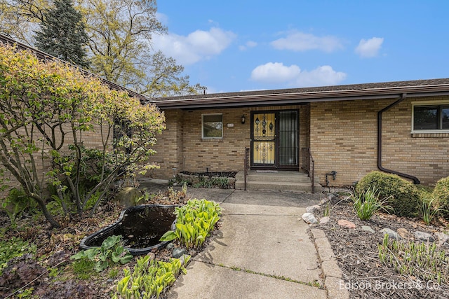 1657 W Kentview Dr NE, Grand Rapids, MI 49505 - doorway to property featuring brick siding