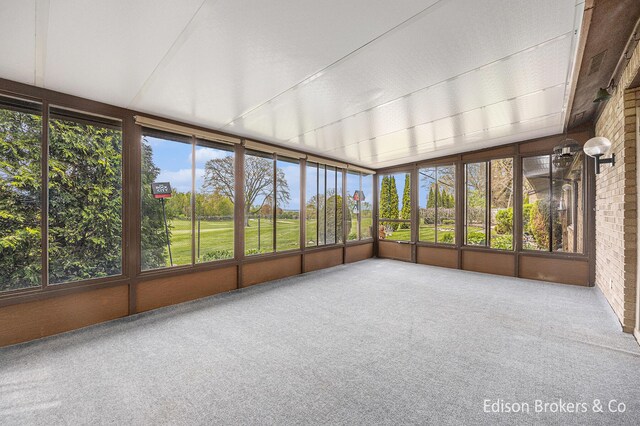 1657 W Kentview Dr NE, Grand Rapids, MI 49505 - unfurnished sunroom featuring carpet floors and plenty of natural light