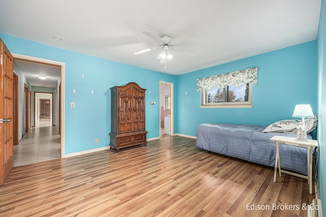 1657 W Kentview Dr NE, Grand Rapids, MI 49505 - bedroom with light wood-style flooring, baseboards, and a ceiling fan