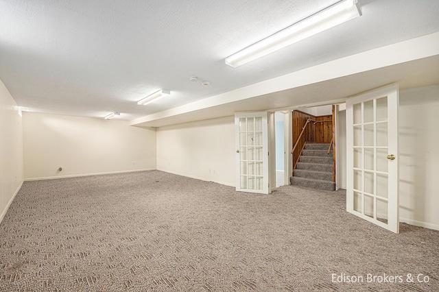 1657 W Kentview Dr NE, Grand Rapids, MI 49505 - finished basement with carpet flooring, stairway, and baseboards