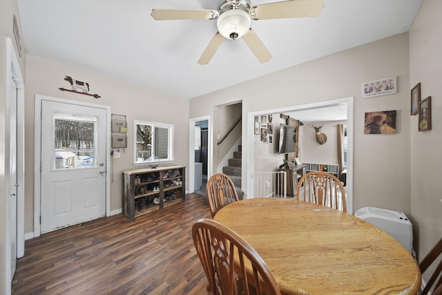 443 S Jackson St, Hanover, MI 49241 - dining room featuring dark wood finished floors, stairs, ceiling fan, and baseboards