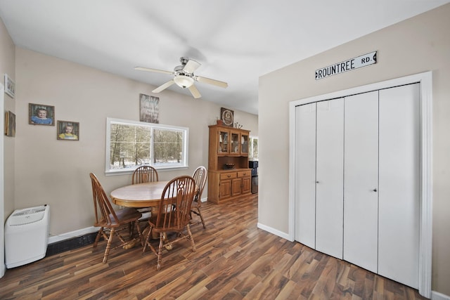 443 S Jackson St, Hanover, MI 49241 - dining room featuring wood finished floors, baseboards, and a ceiling fan
