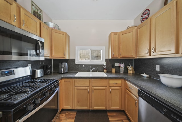 443 S Jackson St, Hanover, MI 49241 - kitchen with appliances with stainless steel finishes, a sink, backsplash, and dark countertops