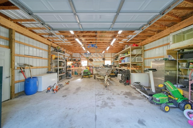 443 S Jackson St, Hanover, MI 49241 - garage featuring a workshop area and fridge