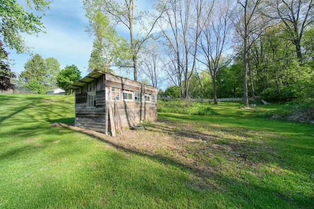 443 S Jackson St, Hanover, MI 49241 - view of green lawn featuring an outbuilding and a storage shed