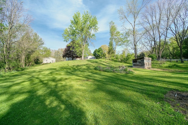 443 S Jackson St, Hanover, MI 49241 - view of green lawn featuring an outbuilding