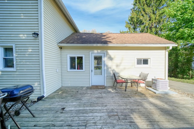 443 S Jackson St, Hanover, MI 49241 - rear view of house with a deck, central AC, outdoor dining space, and roof with shingles
