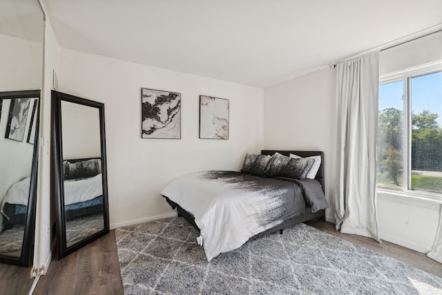 9601 Bayview Dr # 301, Ypsilanti, MI 48197 - bedroom featuring wood finished floors and baseboards