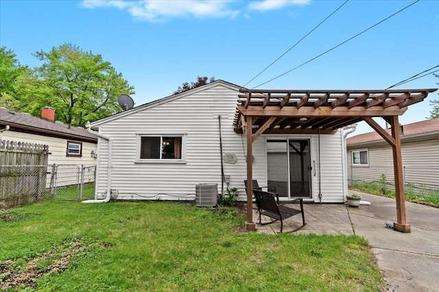back of house featuring a patio area, a pergola, and central AC