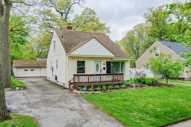 view of front of home with a wooden deck, an outdoor structure, a chimney, a shingled roof, and a detached garage