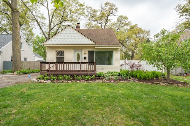 victorian home featuring a wooden deck and a chimney