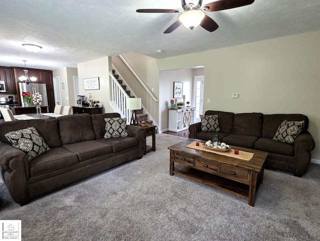 465 Edgewood Pass, Fenton, MI 48430 - living area with carpet, stairway, a chandelier, ceiling fan, and a textured ceiling