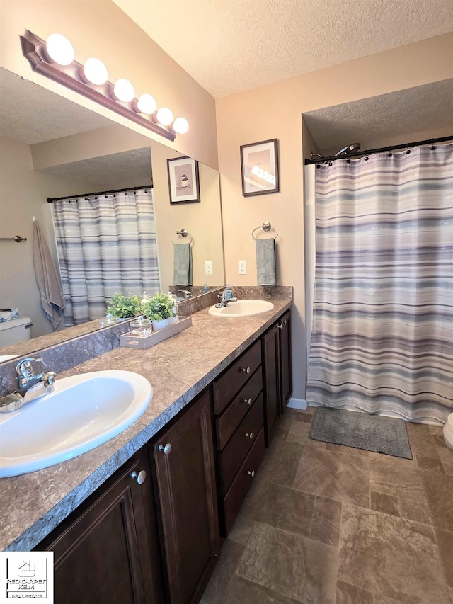 465 Edgewood Pass, Fenton, MI 48430 - full bathroom with toilet, double vanity, and a textured ceiling