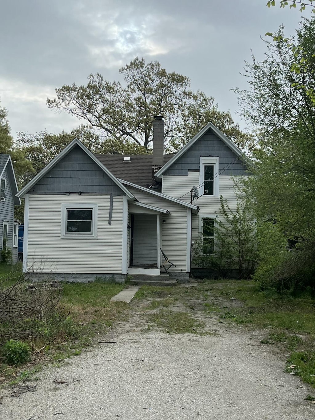 2829 Leahy St, Muskegon, MI 49444 - bungalow featuring a chimney