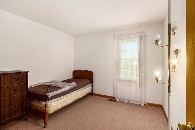 3480 S Vassar Rd, Burton, MI 48519 - bedroom featuring light colored carpet and baseboards