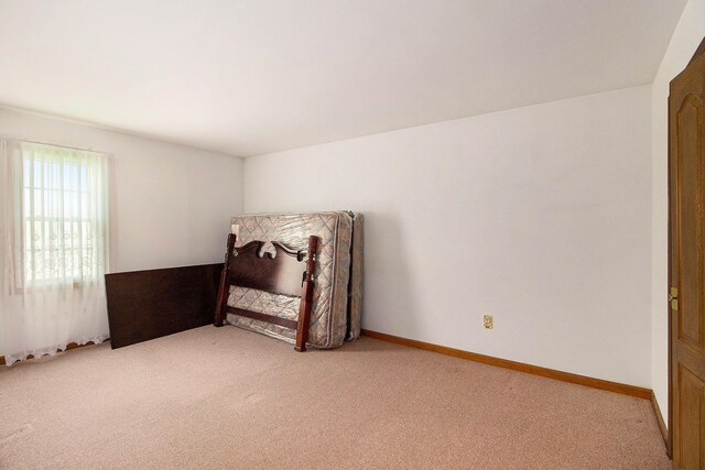 3480 S Vassar Rd, Burton, MI 48519 - bedroom featuring light carpet and baseboards