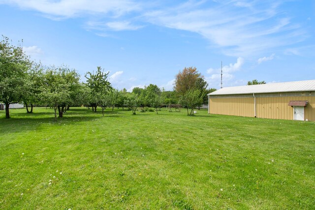 3480 S Vassar Rd, Burton, MI 48519 - view of grassy yard featuring an outbuilding