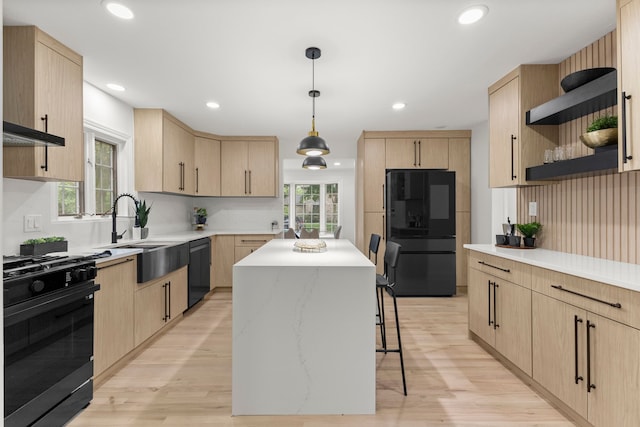 21984 Wildwood St, Dearborn, MI 48128 - kitchen with black appliances, light brown cabinets, open shelves, a center island, and recessed lighting