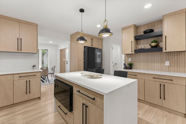 21984 Wildwood St, Dearborn, MI 48128 - kitchen with black appliances, light brown cabinets, open shelves, light wood finished floors, and recessed lighting