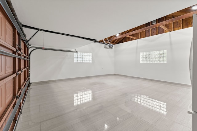 21984 Wildwood St, Dearborn, MI 48128 - garage with baseboards and a garage door opener