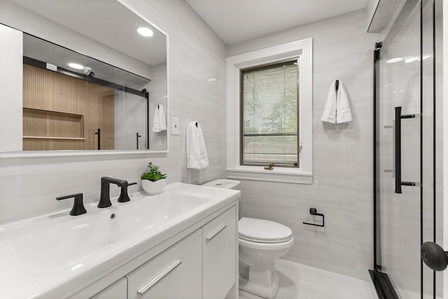 21984 Wildwood St, Dearborn, MI 48128 - bathroom with a shower stall, vanity, toilet, tile walls, and recessed lighting