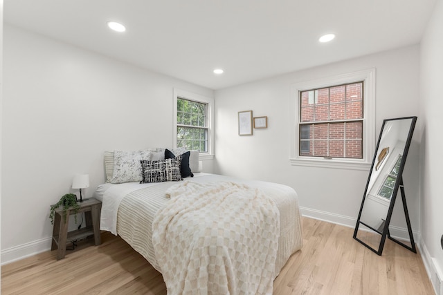 21984 Wildwood St, Dearborn, MI 48128 - bedroom with light wood-style flooring, baseboards, and recessed lighting