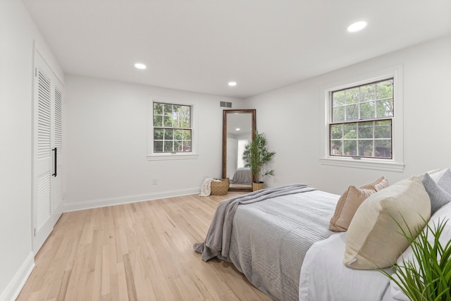 21984 Wildwood St, Dearborn, MI 48128 - bedroom with multiple windows, light wood-style flooring, recessed lighting, and baseboards
