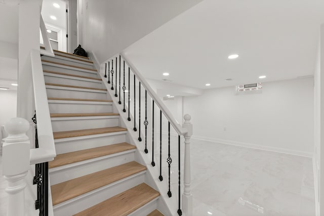 21984 Wildwood St, Dearborn, MI 48128 - stairway with recessed lighting, baseboards, and marble look tile flooring